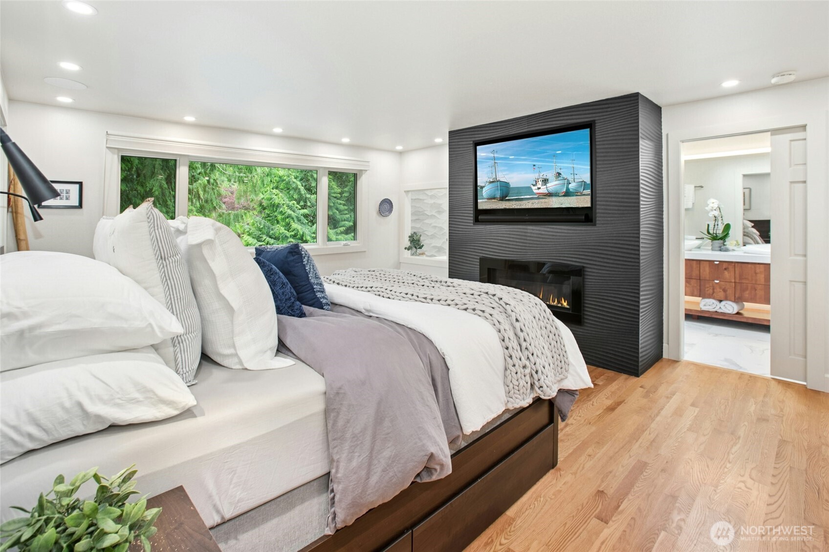 Gorgeous primary en suite with incredible upgrades including Dimmed lights, gas fireplace with European imported high quality tiles, TV embedded and Sonos speakers in ceiling & hardwood floors.