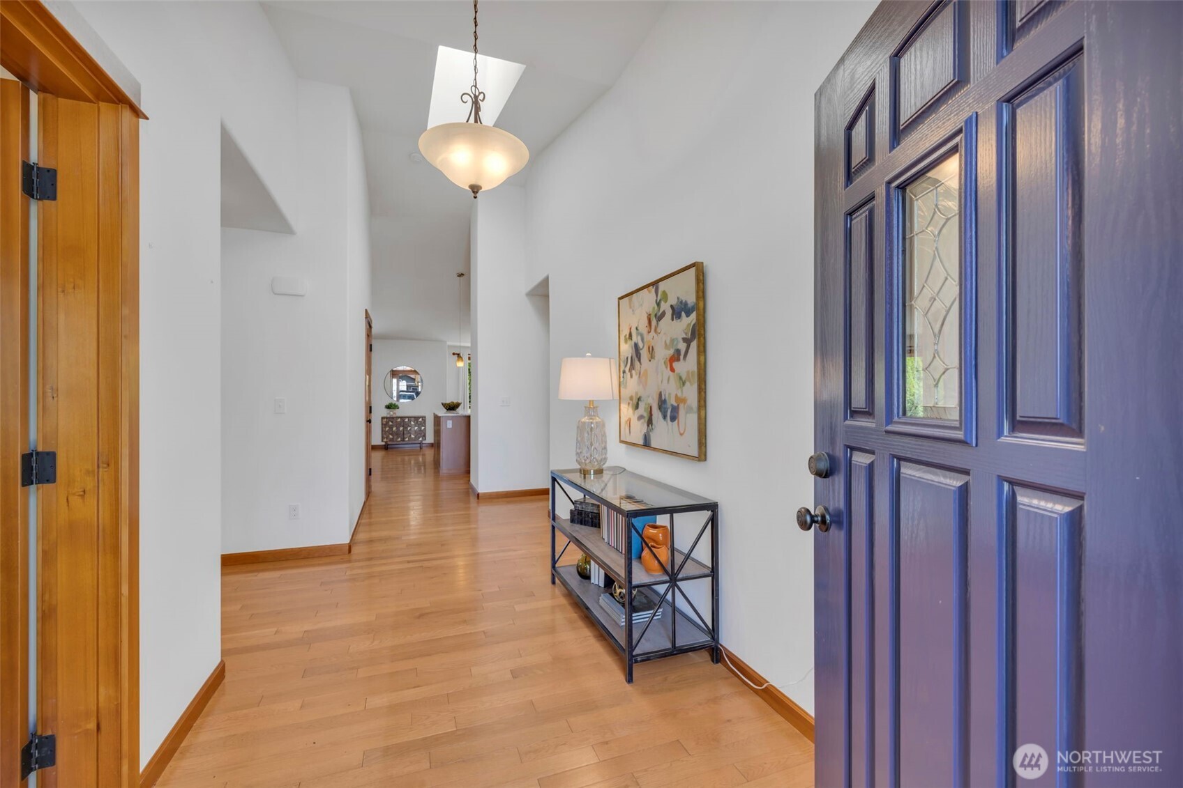 Spacious entry way and gorgeous hardwood floors greet you when you enter this home