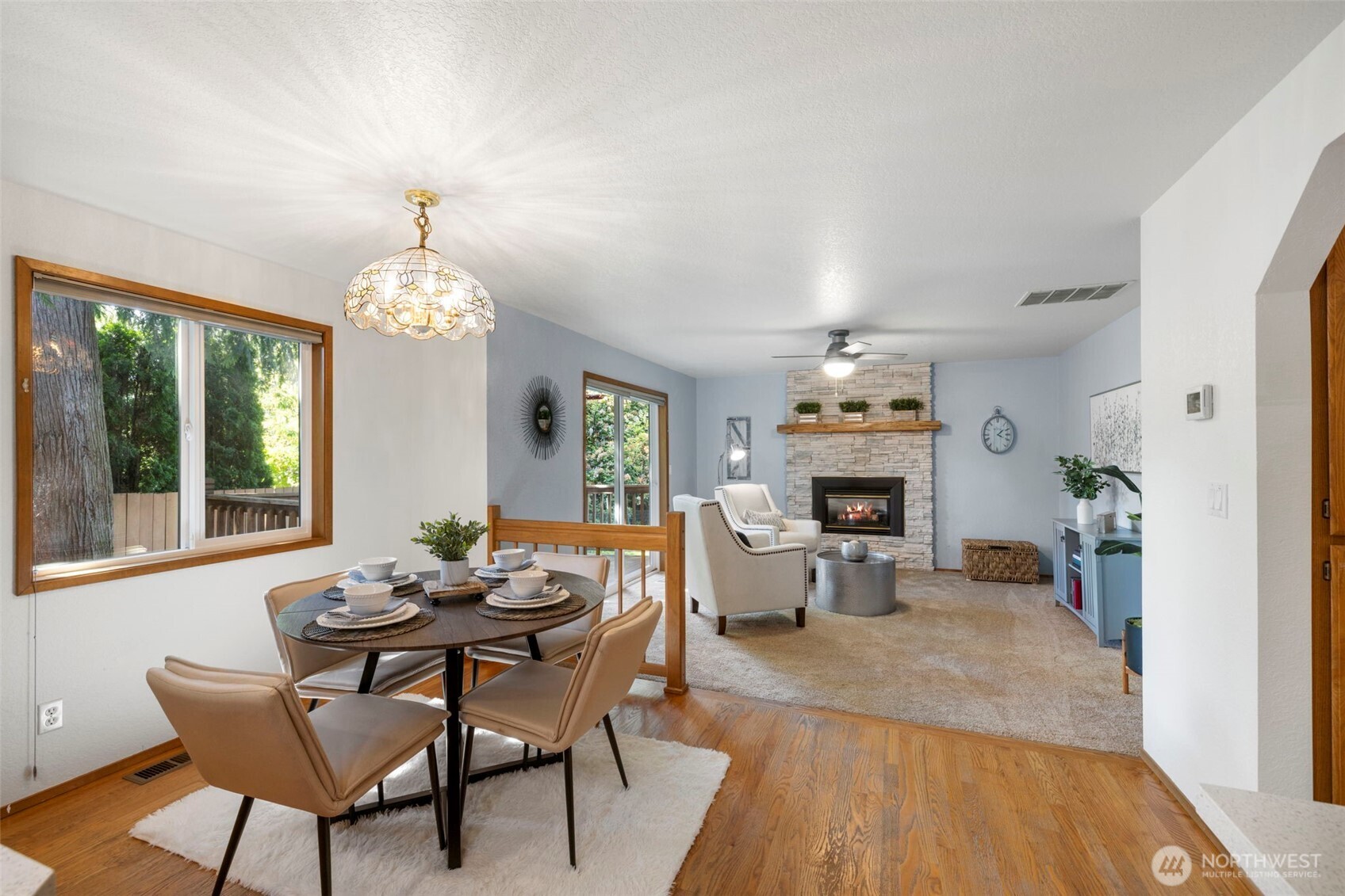 Breakfast nook and family room with gas fireplace.