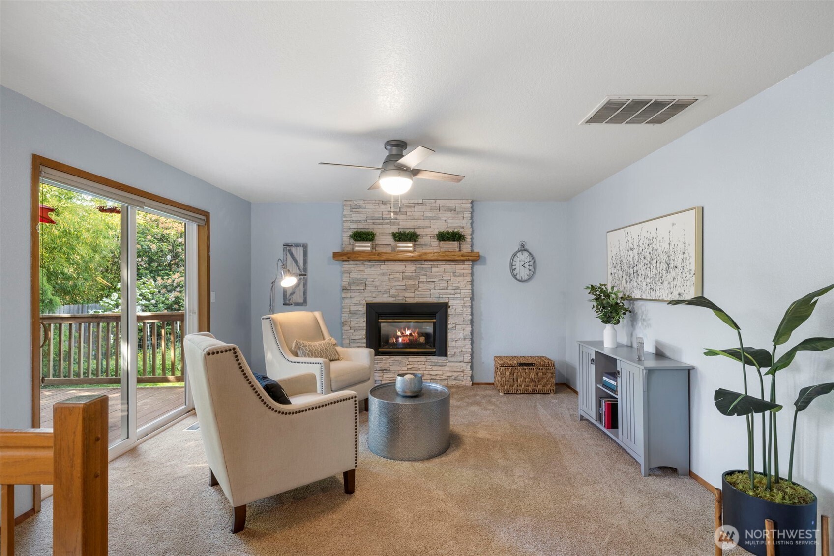 Sliding doors from family out to back dec and private backyard.
