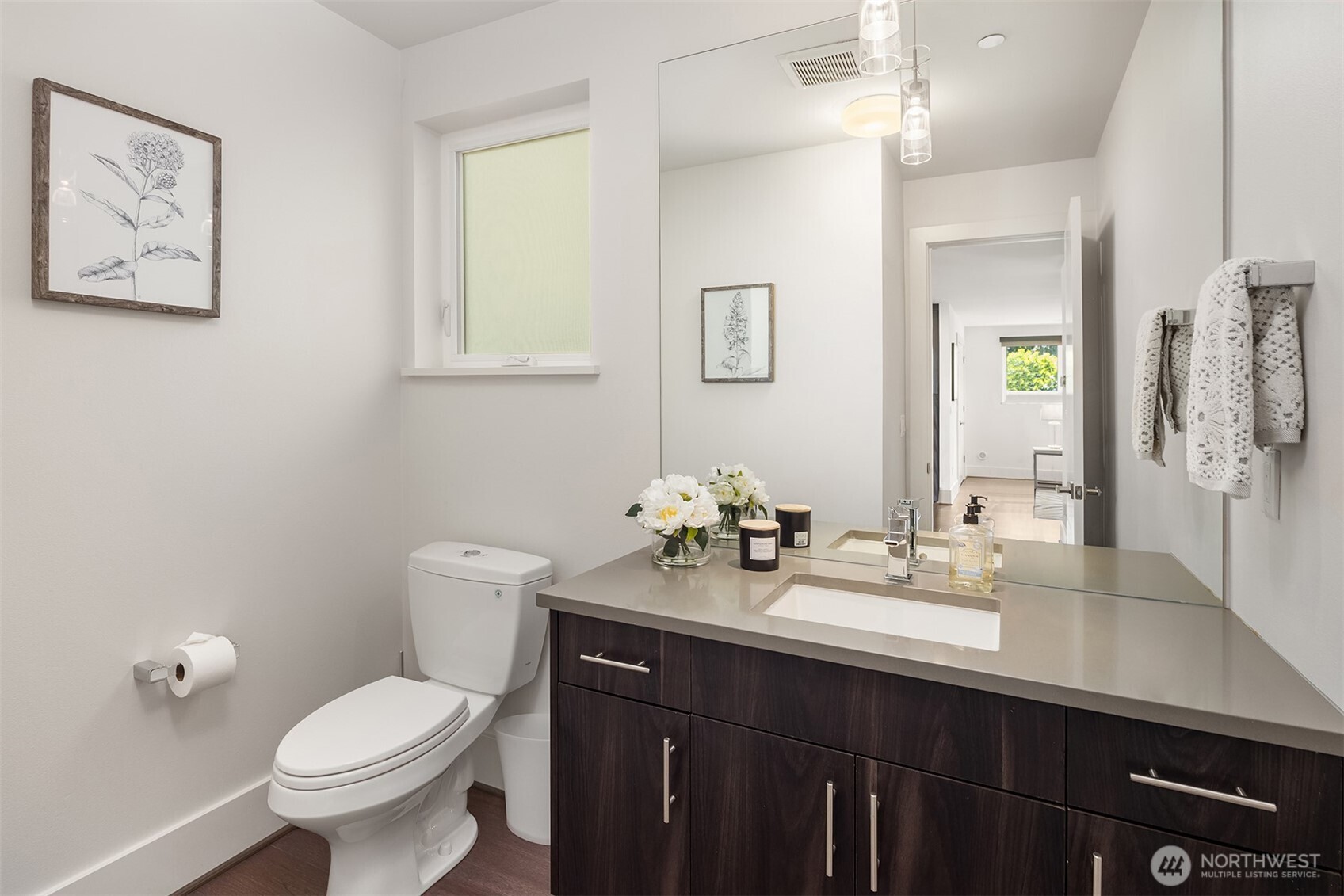 Bathroom near kitchen and living area.