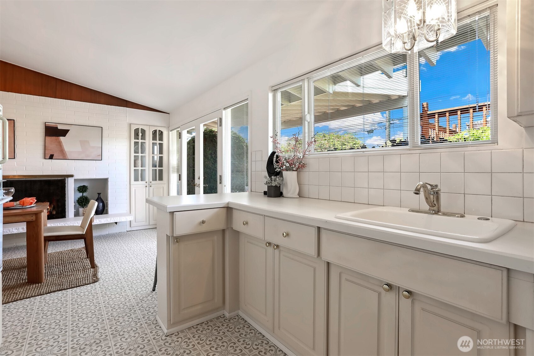 Bright kitchen overlooks the deck and back yard to the West.
