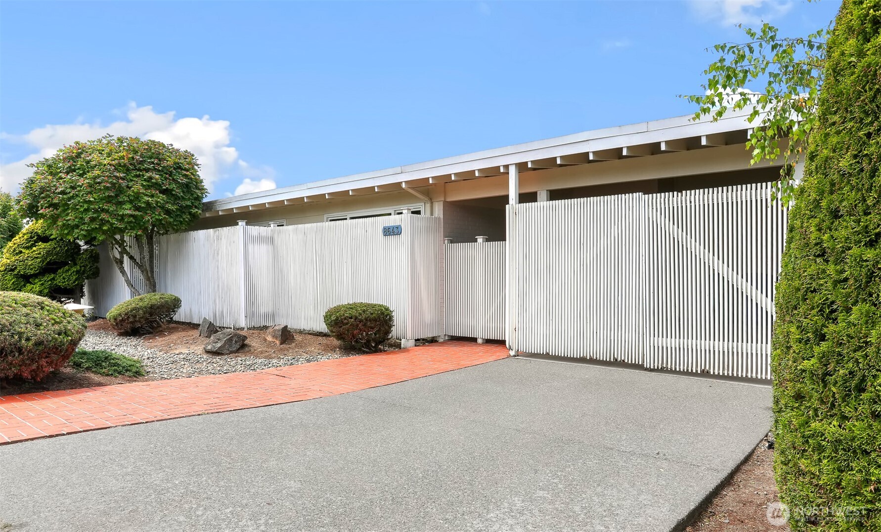 Private entrance and enclosed carport.