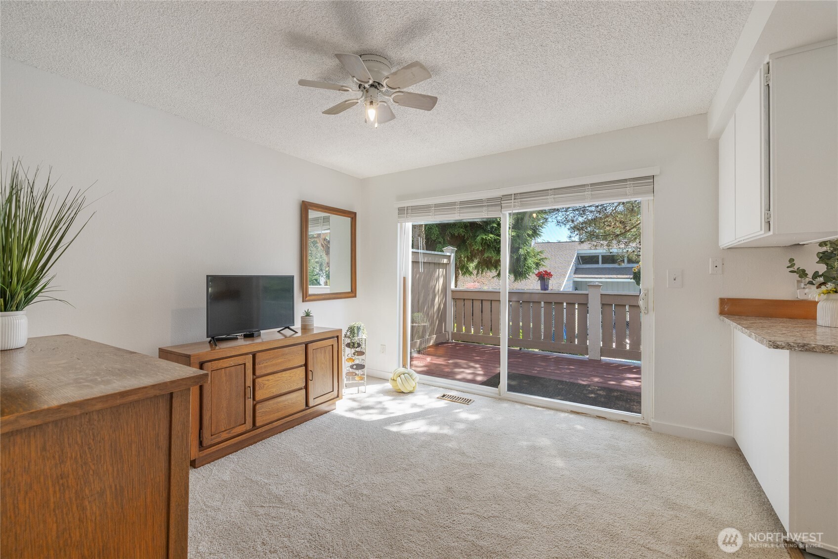 This room could make for a great office or sitting area with slider out to one of the decks