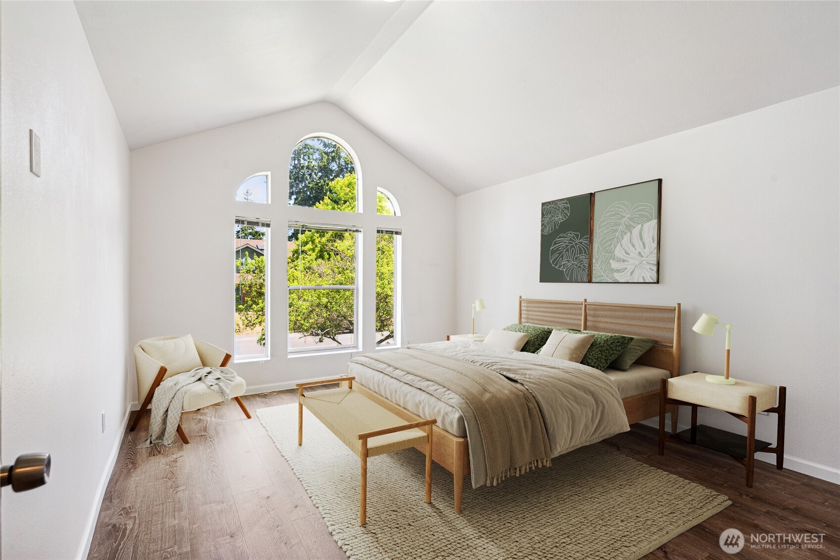 Virtual Staging - The primary suite is a sanctuary of relaxation, embellished with architectural details like vaulted ceilings, floor to ceiling large windows for all the natural light, new LVP flooring and new baseboard trims.