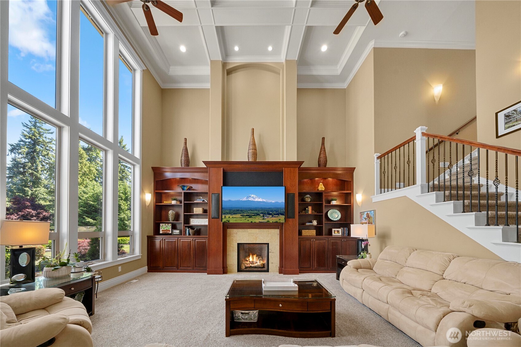 Exceptional family room w/built-ins, gas fireplace, acces to 2nd level. Custom details in ceiling, window design & decorating niches.