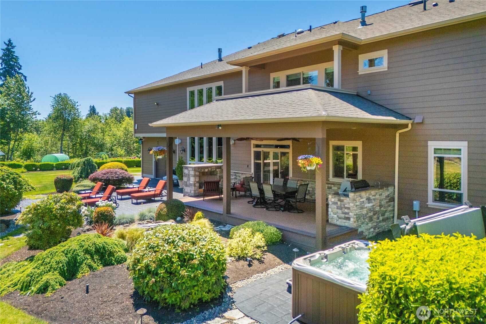 Excellent entertaining area off the Great Room. Built in BBQ area, gas fireplace, covered deck, hot tub...