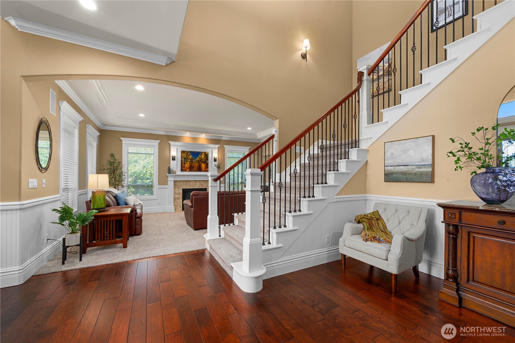 Stairs leading upstairs w/formal living in background. Covered deck off entry & formal living.