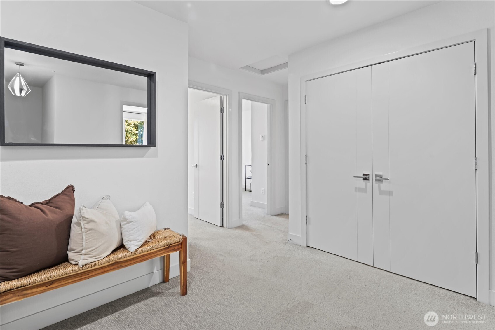 Upstairs landing with access to 3 more bedrooms and laundry center.