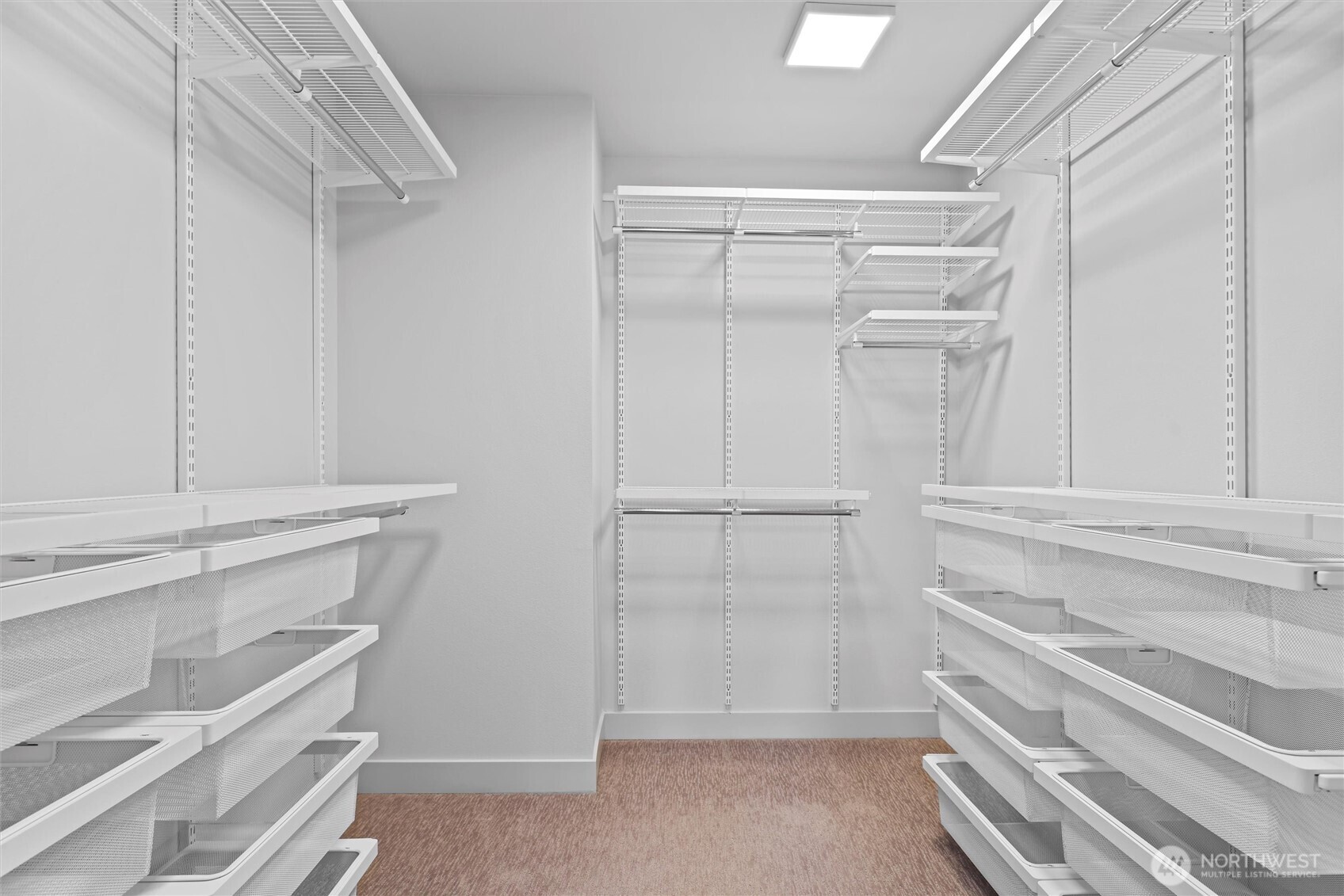 Walk-in closet has been upgraded with Elfa closet system featuring adjustable shelves and drawers.