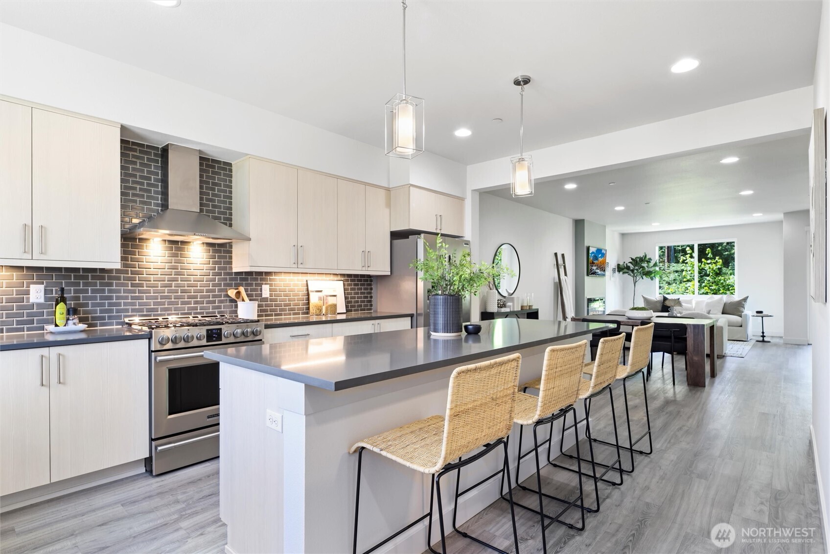 Main floor features well-equiped kitchen with stainless steel appliances, gas cooktop, overhead fan vent and tons of storage.