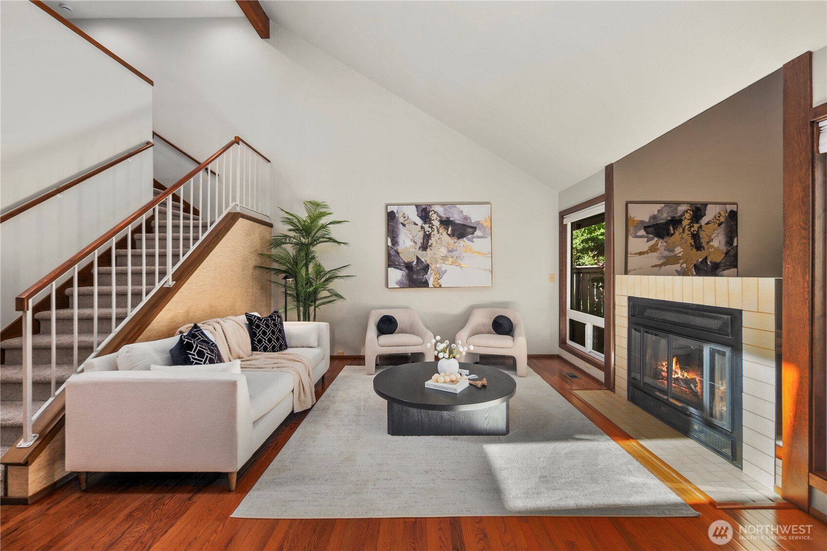 Vaulted ceilings and a skylight add to the spacious feel of the living room