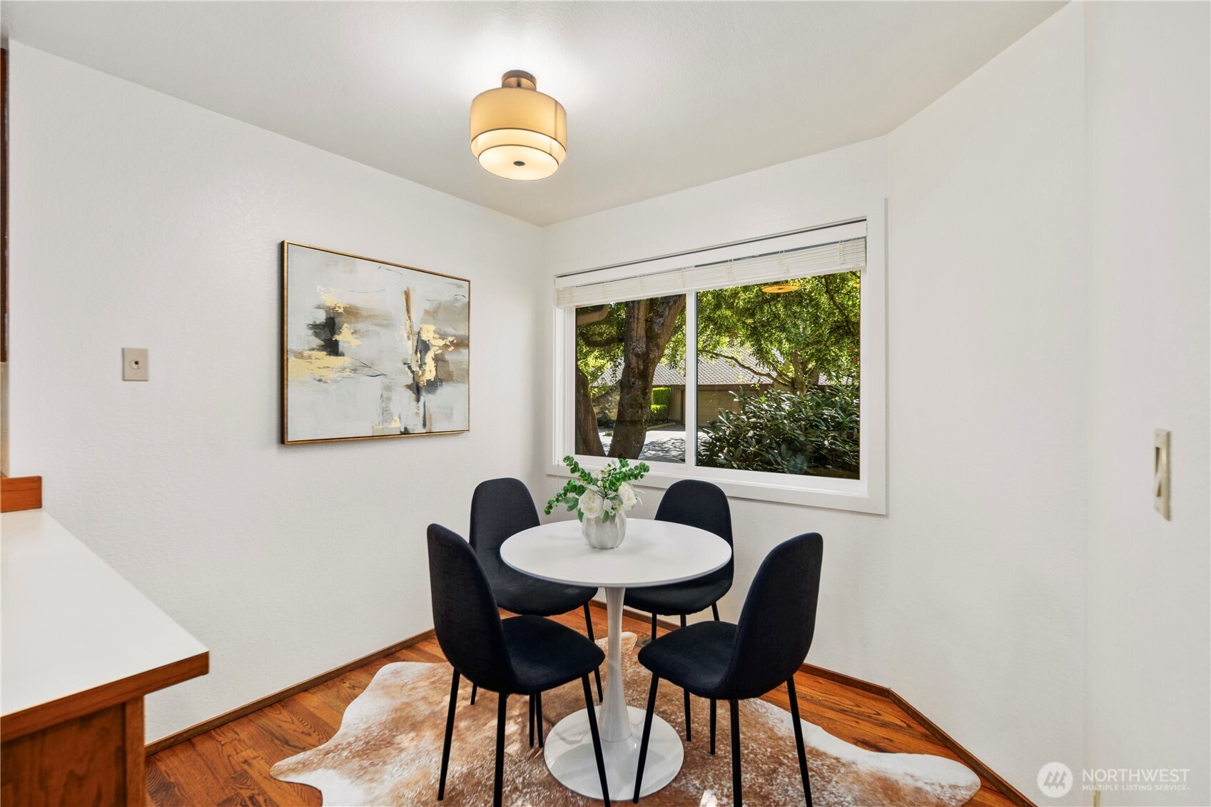 The kitchen features a cozy dining nook, perfect for sipping coffee and enjoying slow mornings