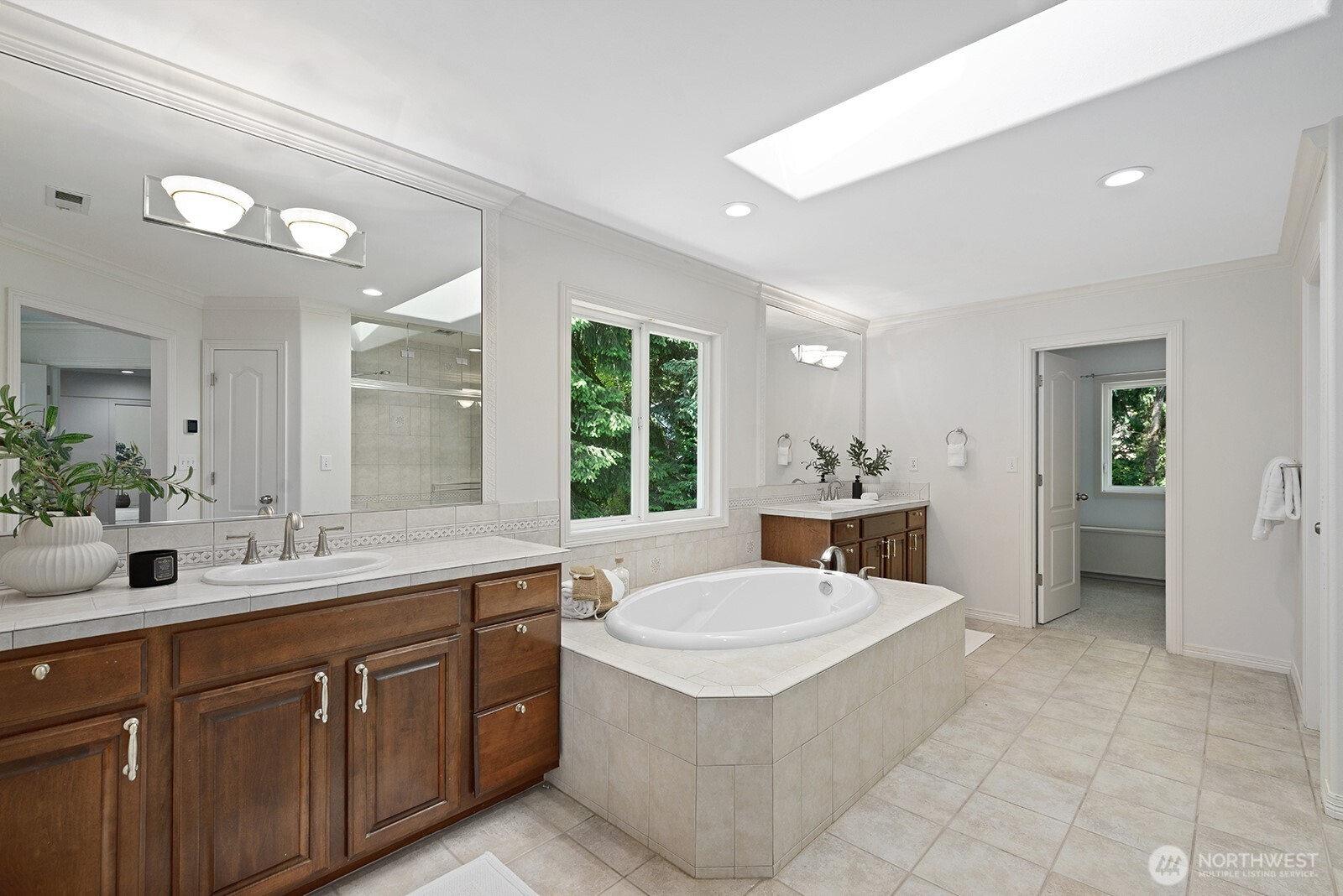 Primary bath with soaking tub, steam shower and large walk-in closet