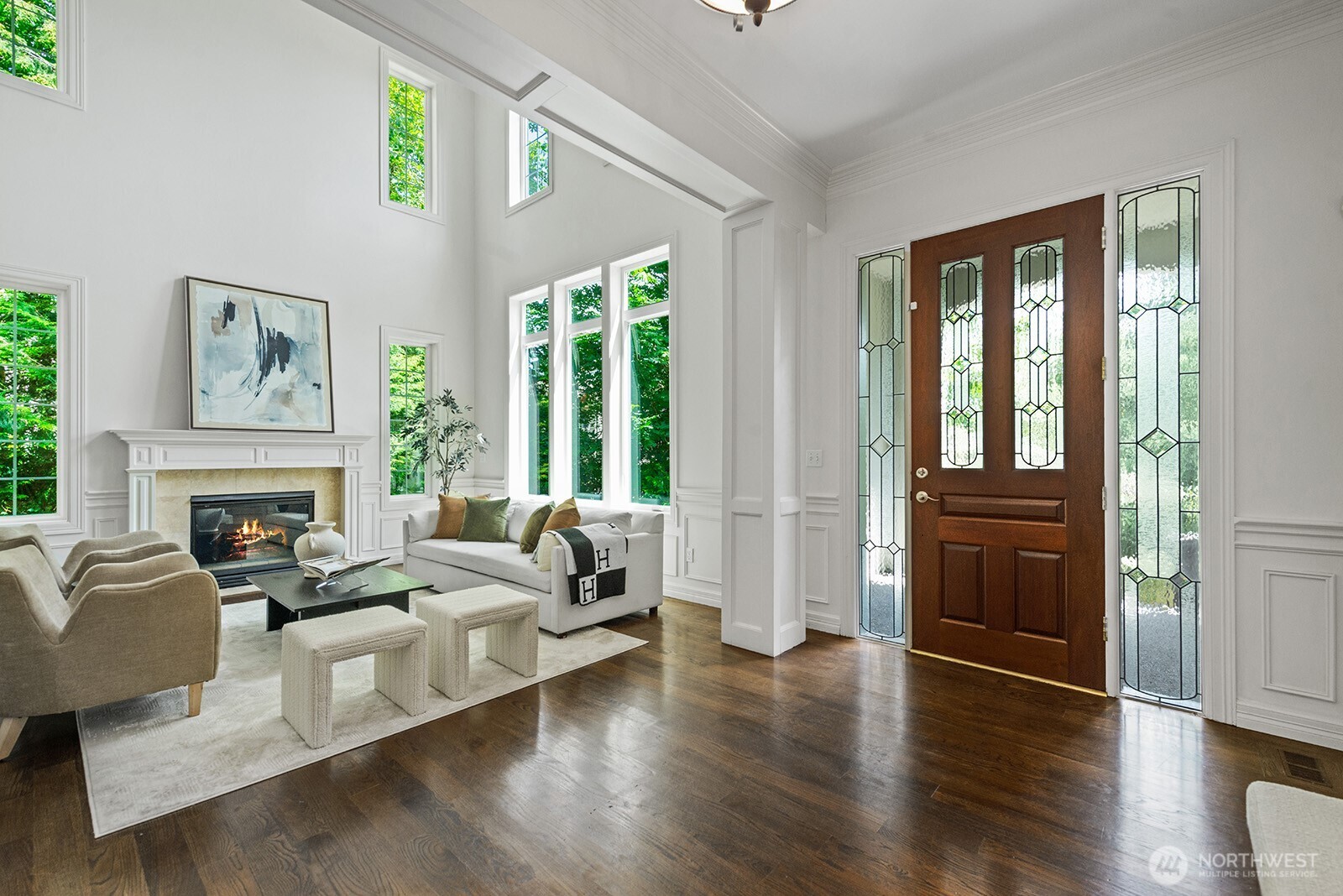 Gorgeous entrance with high ceilings and hardwood floors