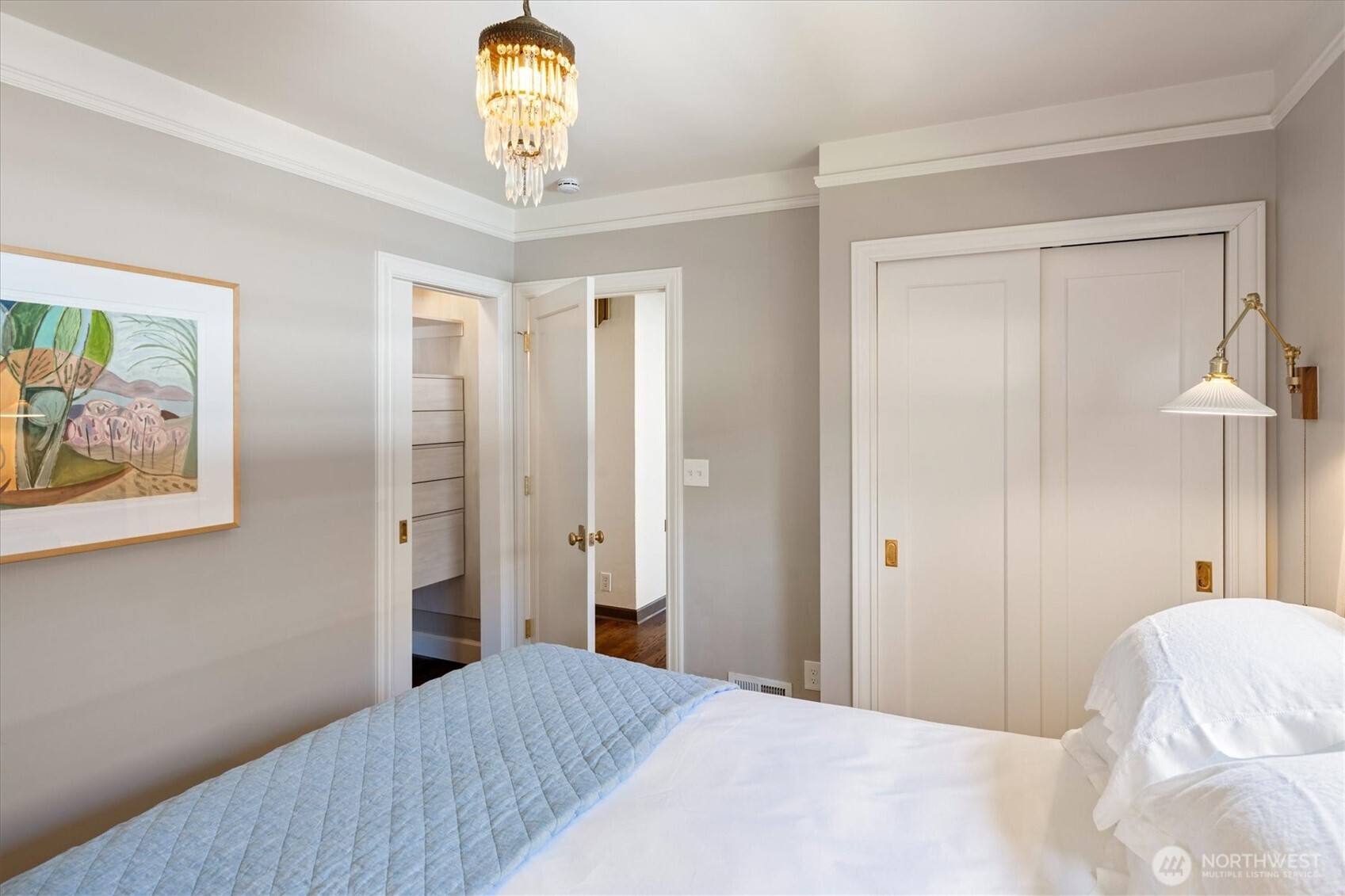Two closets in the primary bedroom with built-ins.