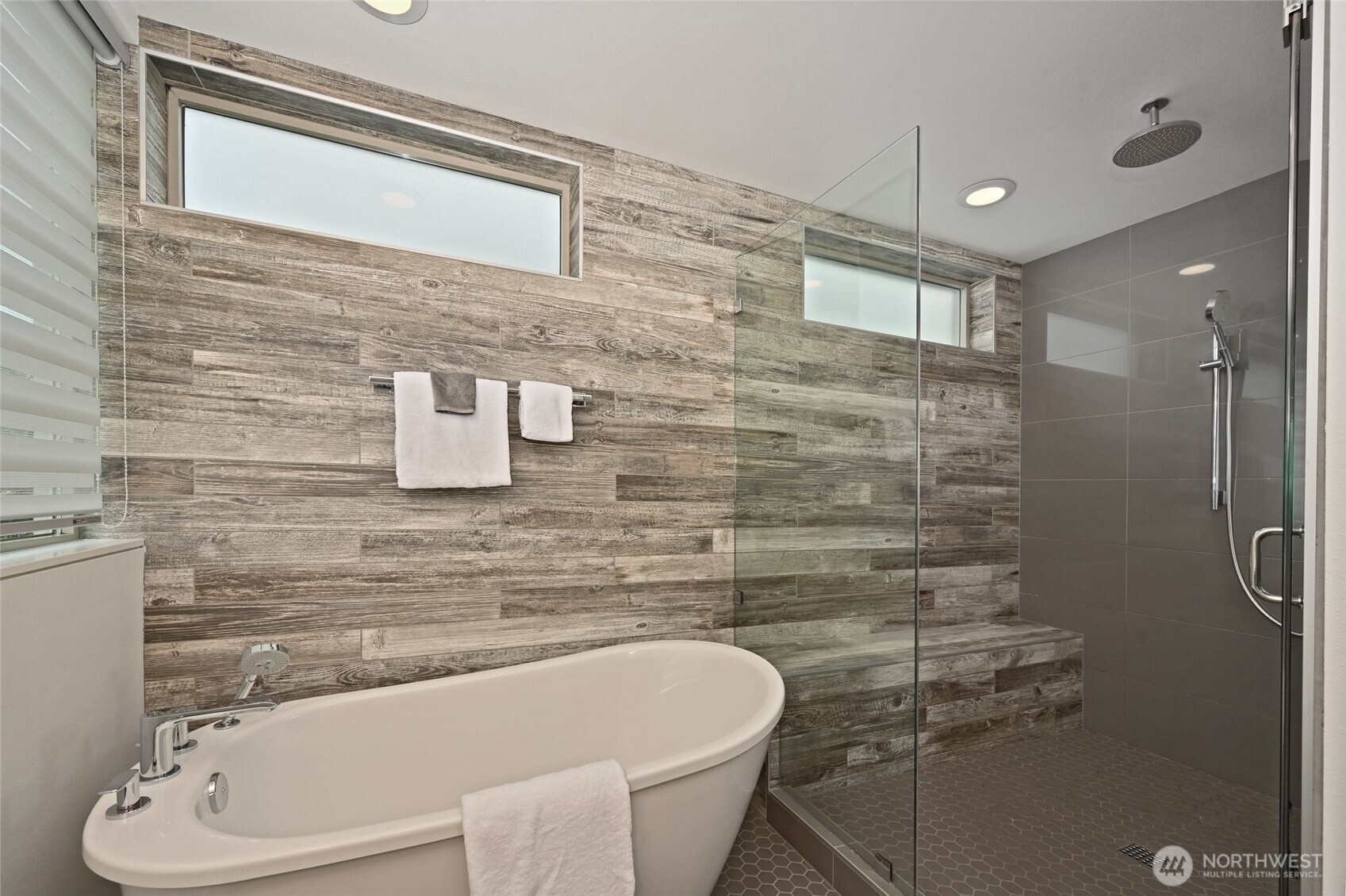 Separate soaking tub and oversized shower.