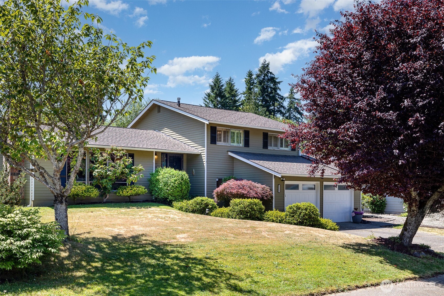 Established landscaping offers excellent curb appeal.