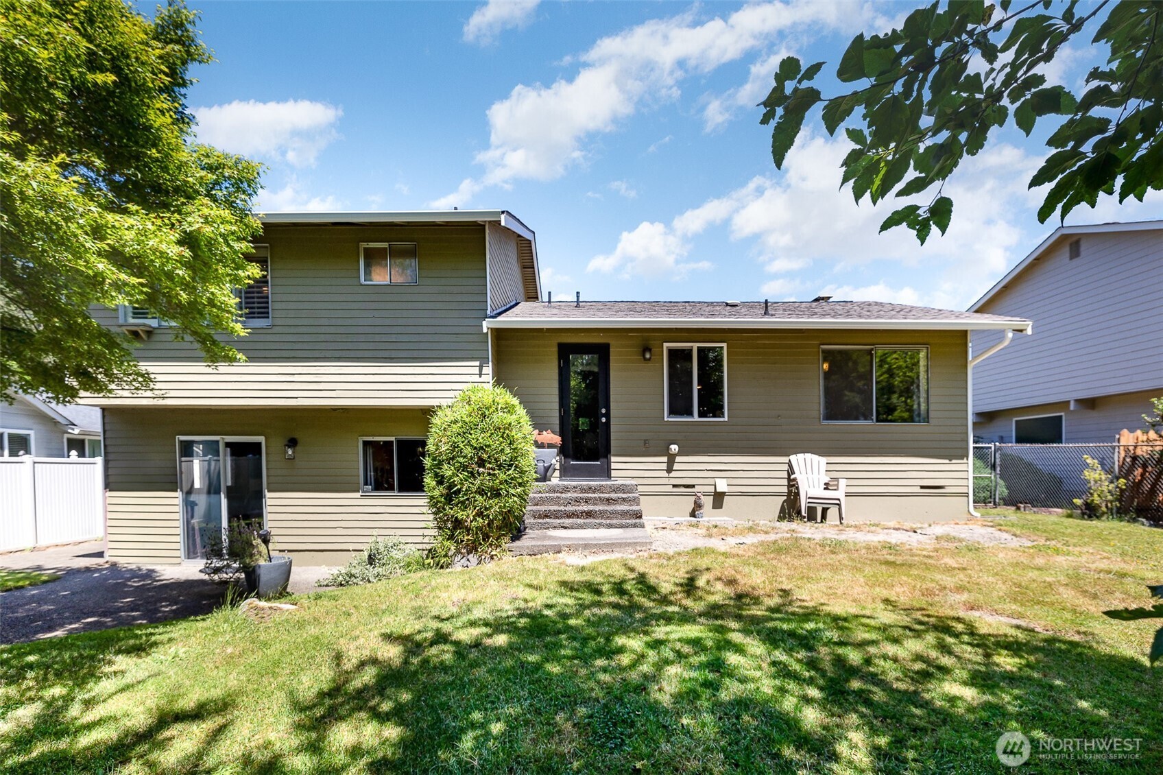 Fully fenced backyard offers privacy and a perfect space for pets, children, or guests.