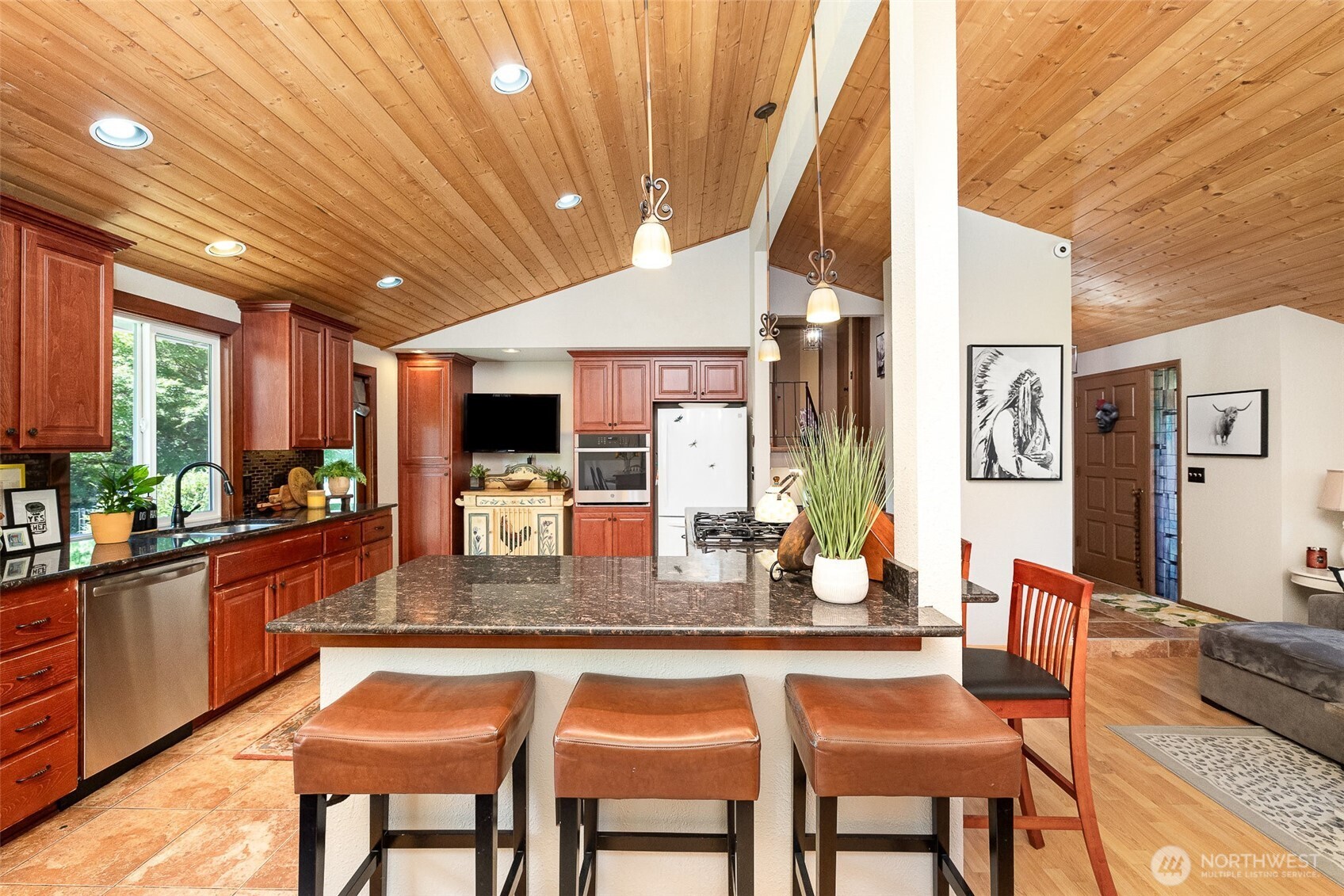 Spacious kitchen with large island with additional eating space, ample storage and seamless flow.