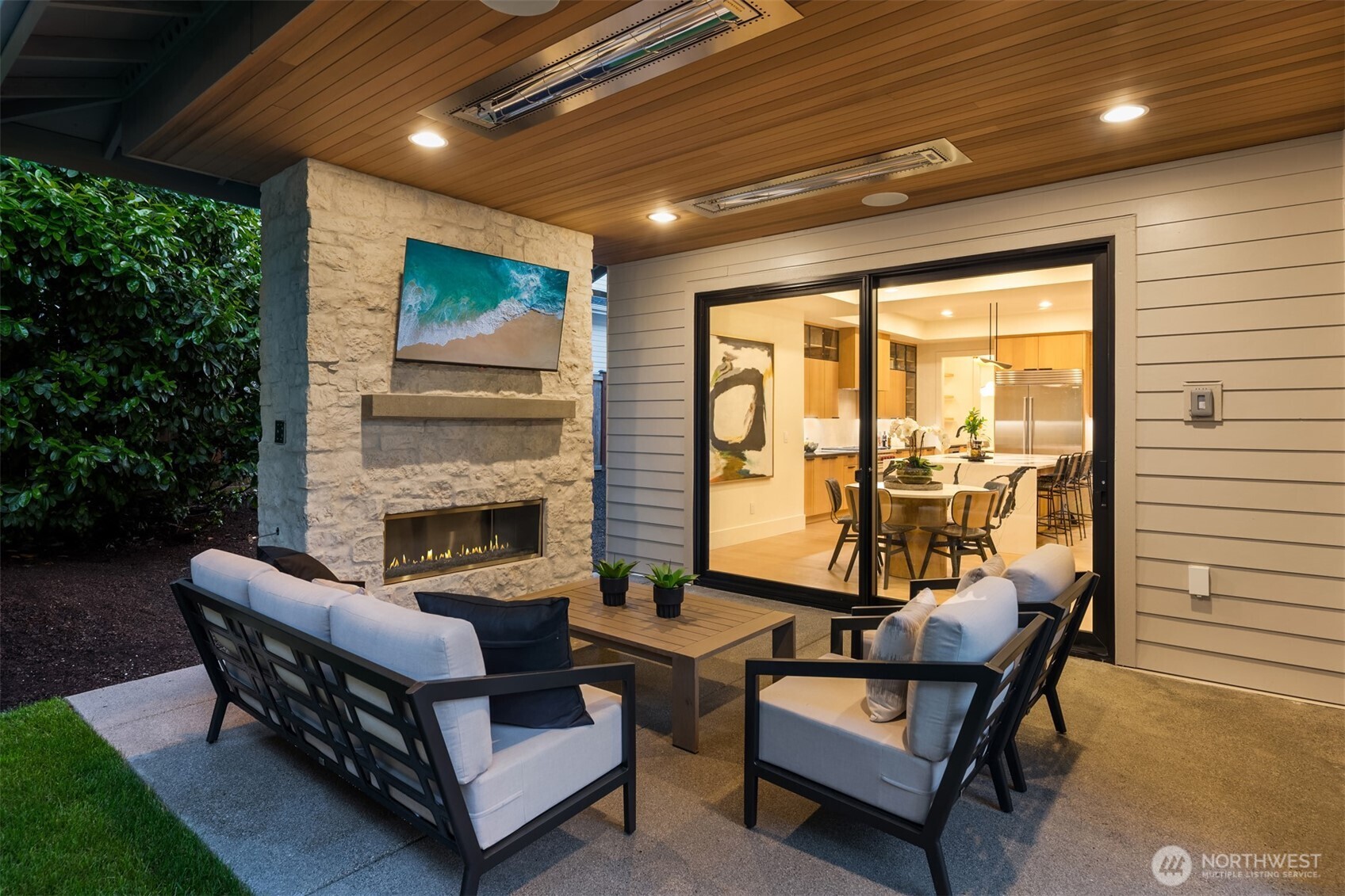 Outdoor covered living area with fireplace