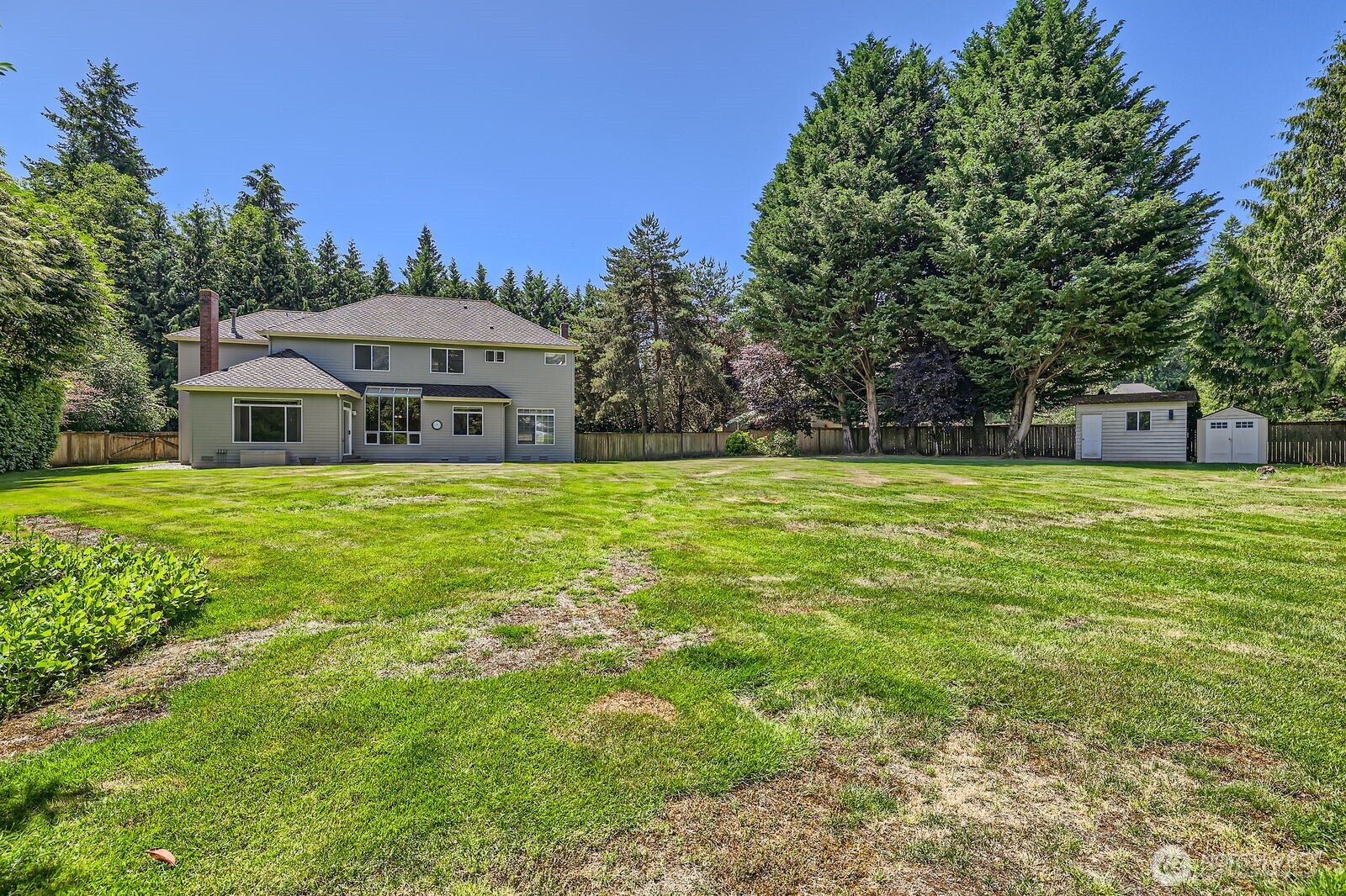 Another look toward the back of the house. New grass seed was just planted and should fill in those bare areas soon.