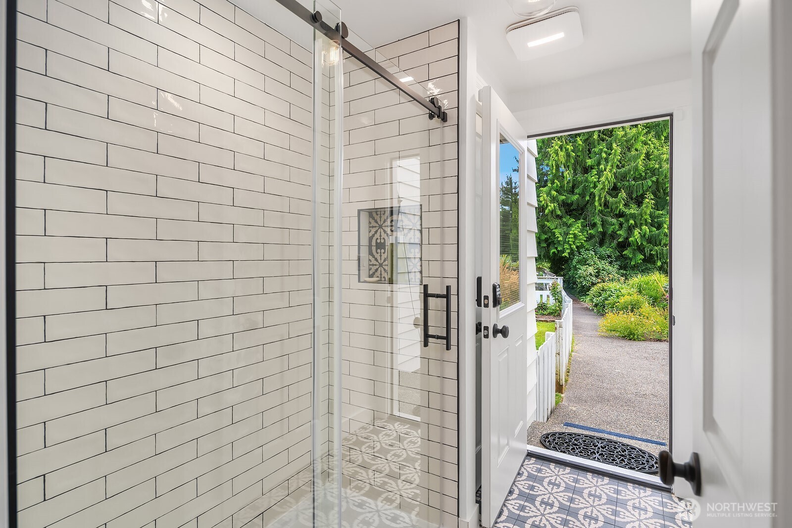 3/4 bath on main, leads out back - perfect for a post-pool rinse!
