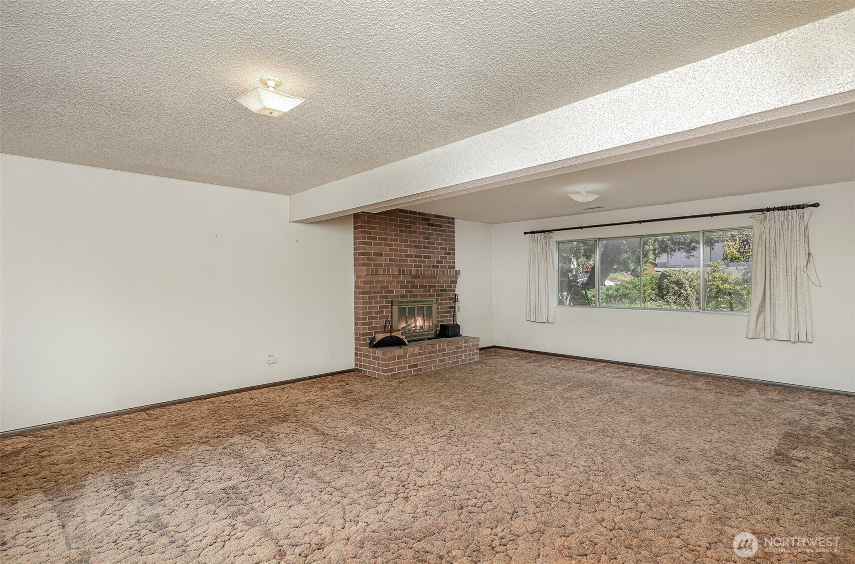 Spacious downstairs recreation room—perfect as a playroom, game room, or a home gym.
