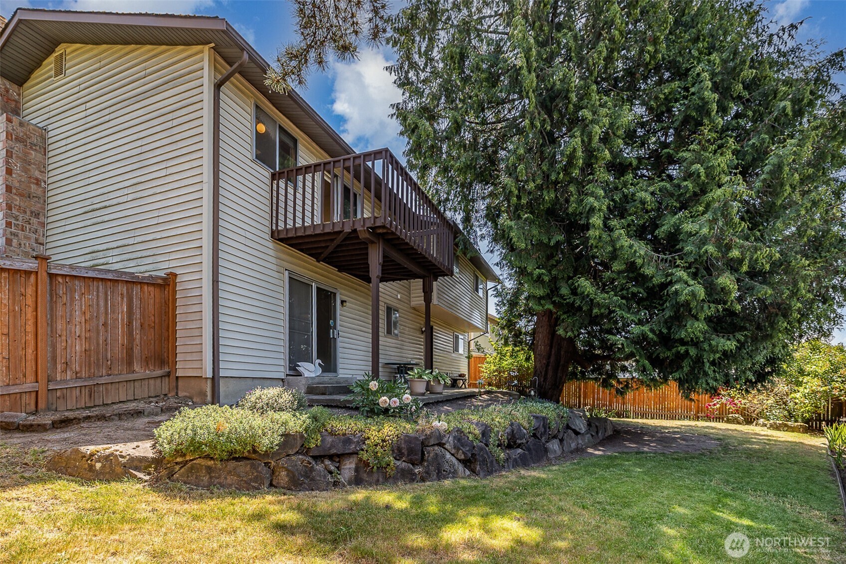 Fully fenced backyard offers a safe and secure outdoor space for everyone.