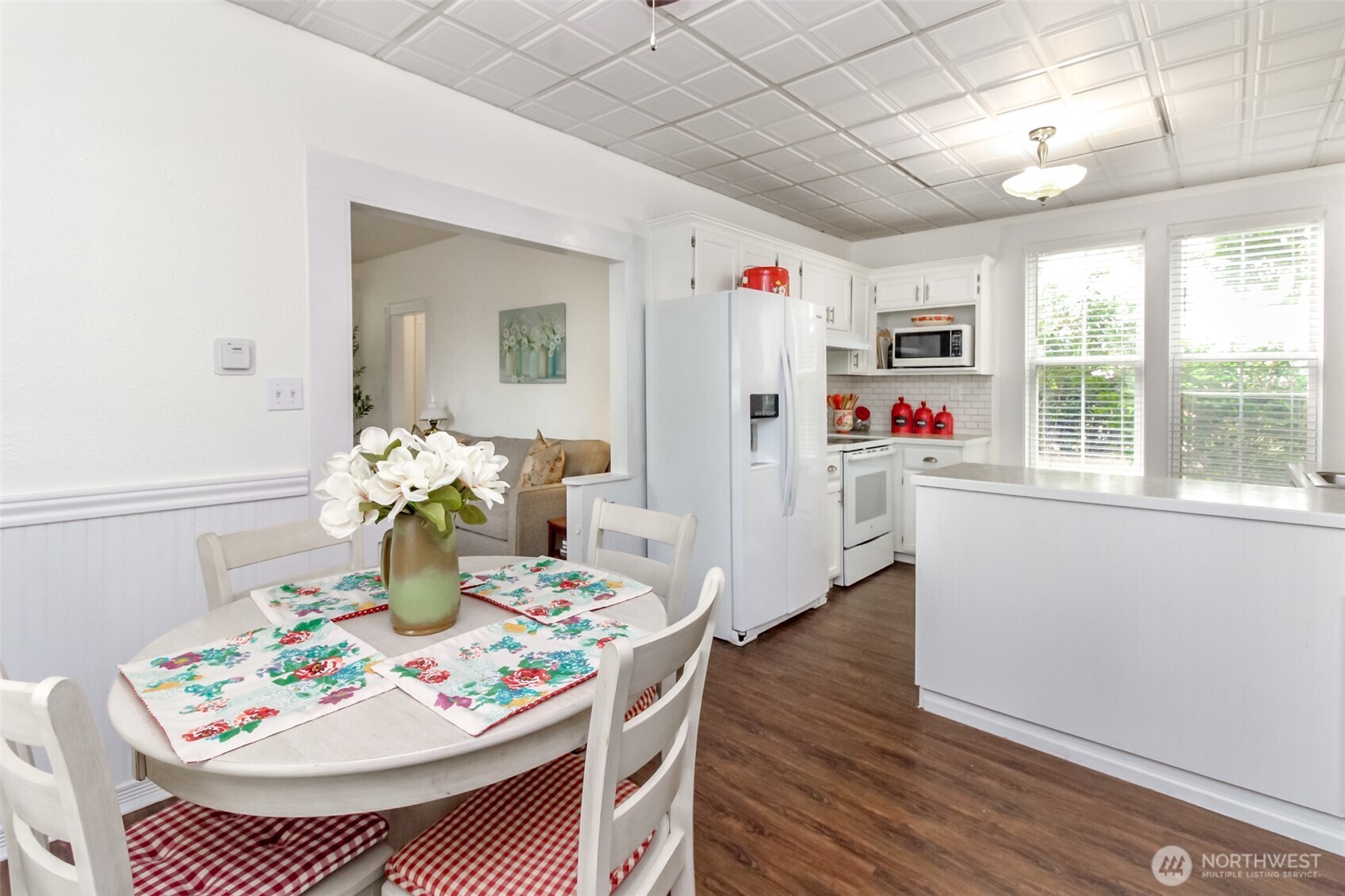 Through the living room to the kitchen w/ eating area.