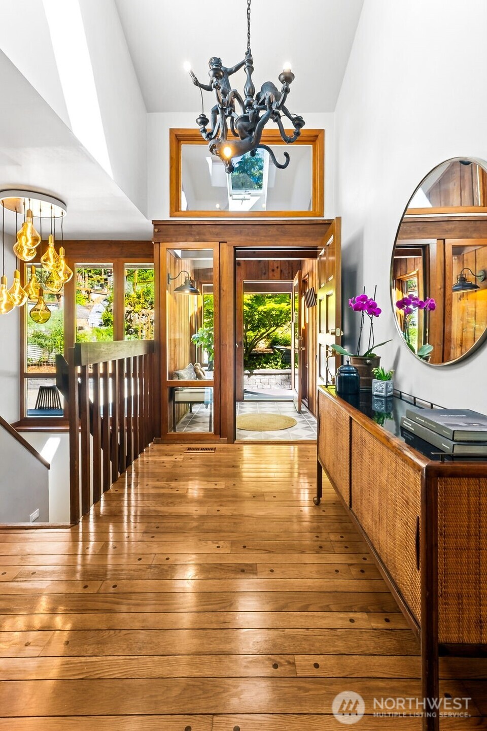 Enter into the main level of the home with high ceilings and windows, and all freshly painted & finished, with original hardwood floors.