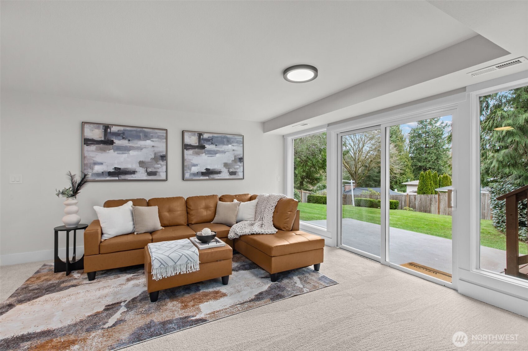 Just a few steps down from the kitchen, find your large family room with yet another wall of windows.