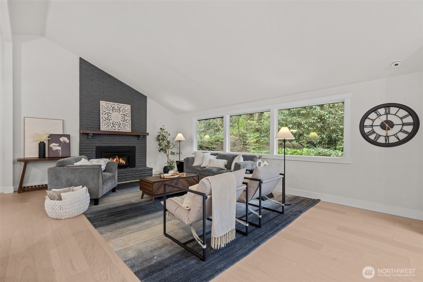 The living room features a vaulted ceiling and cozy gas fireplace.
