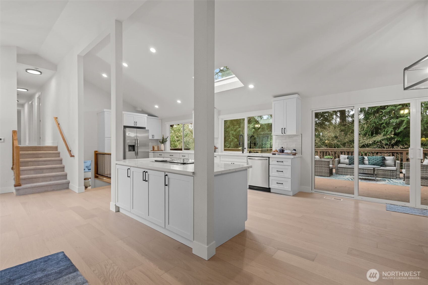 Gorgeous engineered hardwood floors create a timeless and elegant feel throughout the great room.