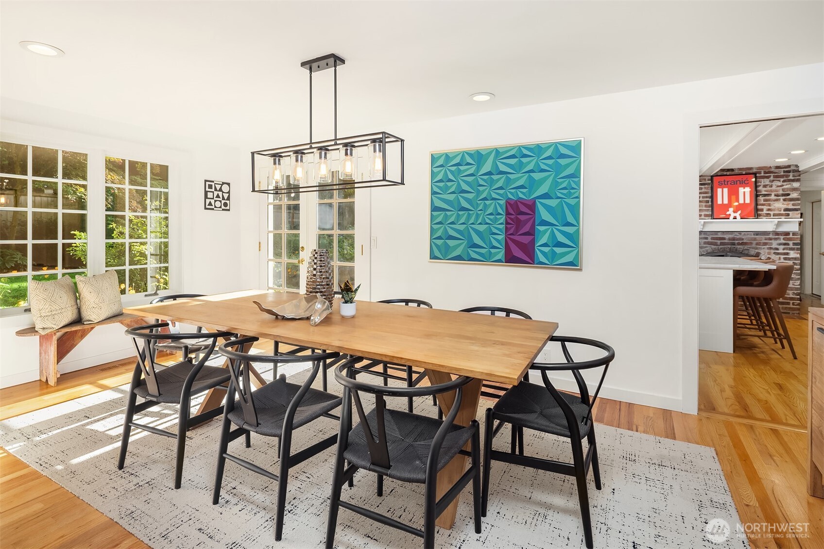 The flow, the fixture, the French doors... the paned glass windows.... what more could you ask for in this beautiful dining space.
