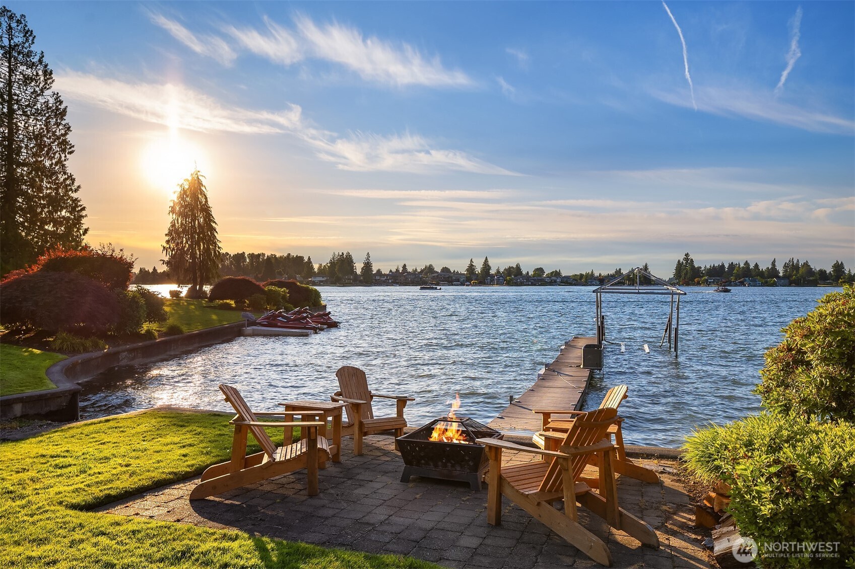 At the water's edge, private dock & covered boat lift. Sheltered sandy beach.