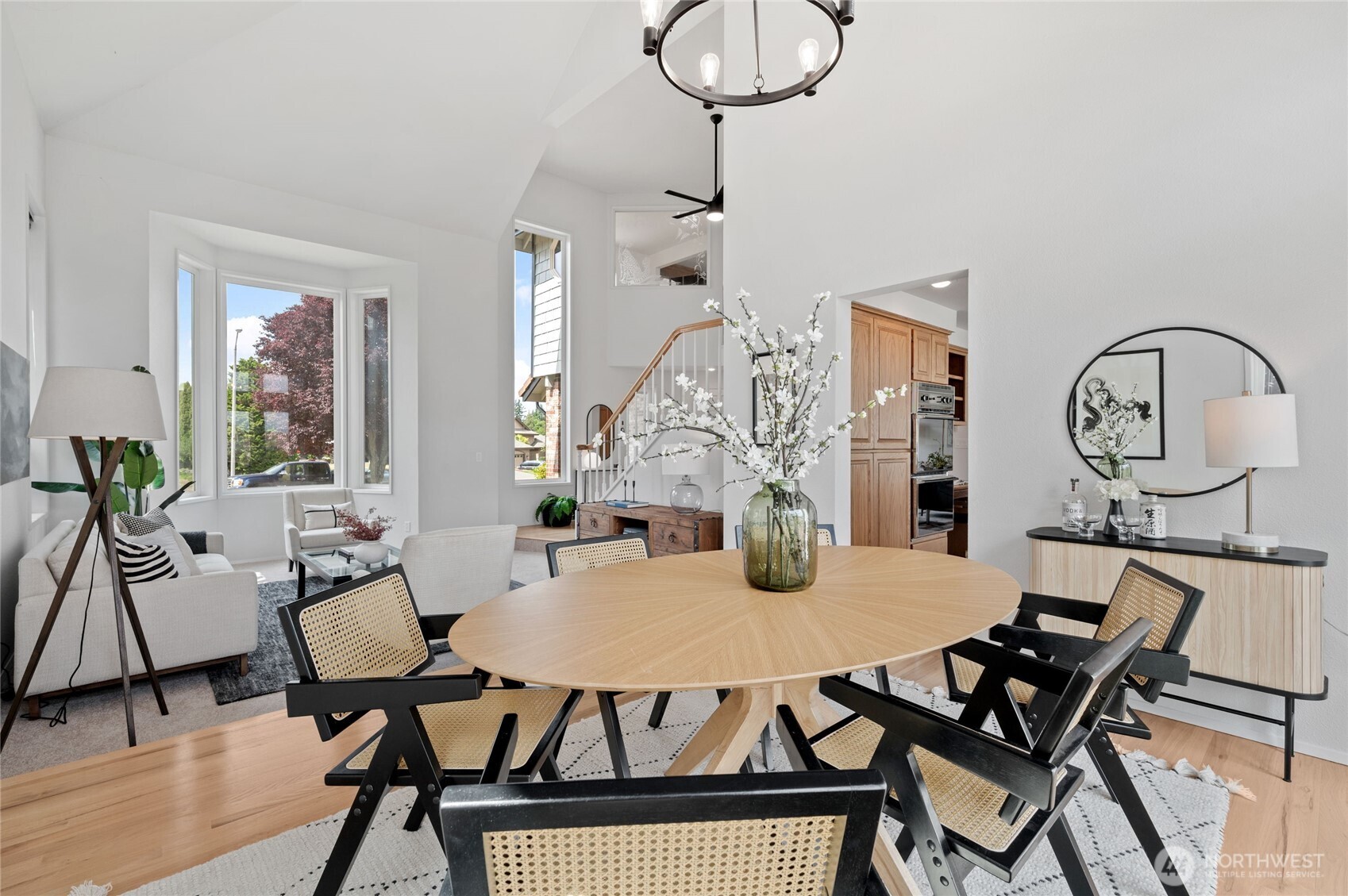 An entertainer’s dream—this Formal Dining Room offers grandeur with vaulted ceilings and a backdrop of the 4th fairway and Mount Rainier from the adjoining patio.