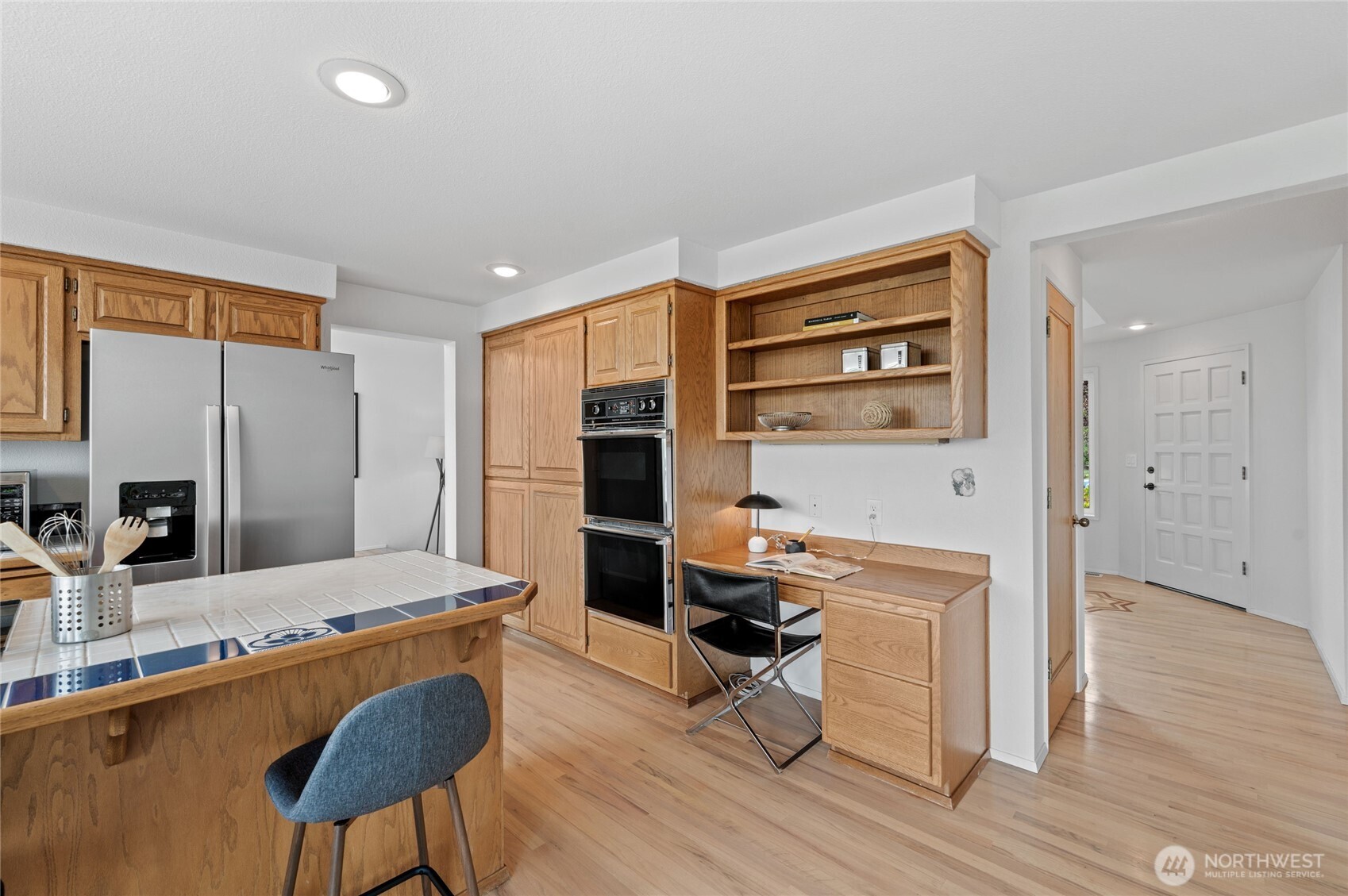 Natural light floods the kitchen and provides panoramic views of the golf course and mountain!