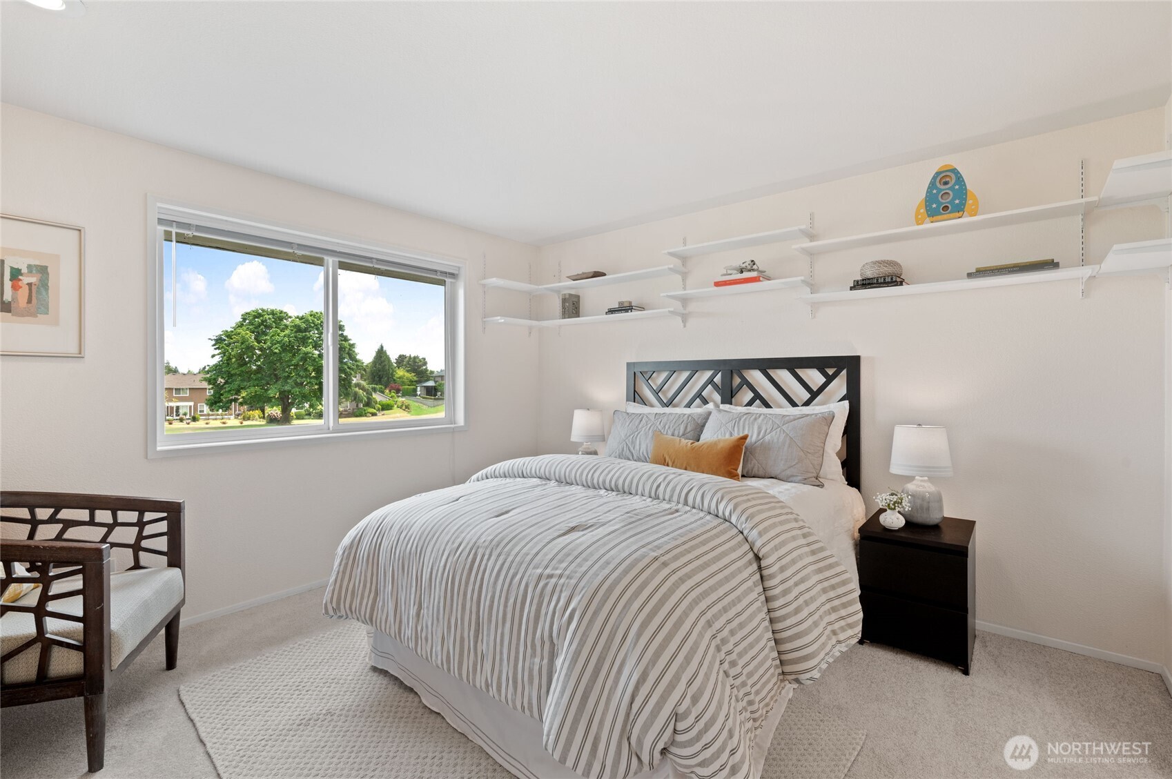Bedroom #1 provides elevated sightlines to the fairway and Mount Rainier, plus a partial view of Lake Tapps to complete the scene.