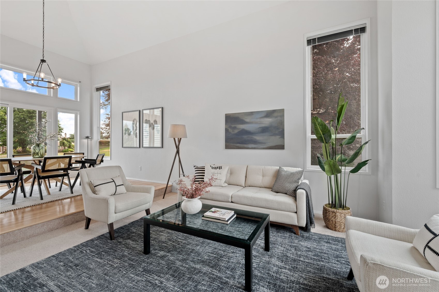 The entry unfolds into beautifully appointed Living and Dining spaces, perfect for entertaining.