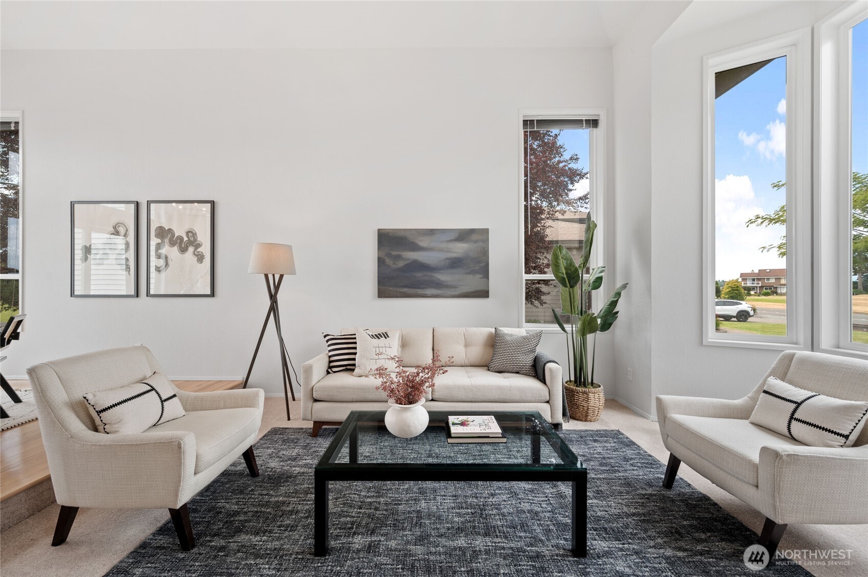 The formal Living Room is filled with natural light.