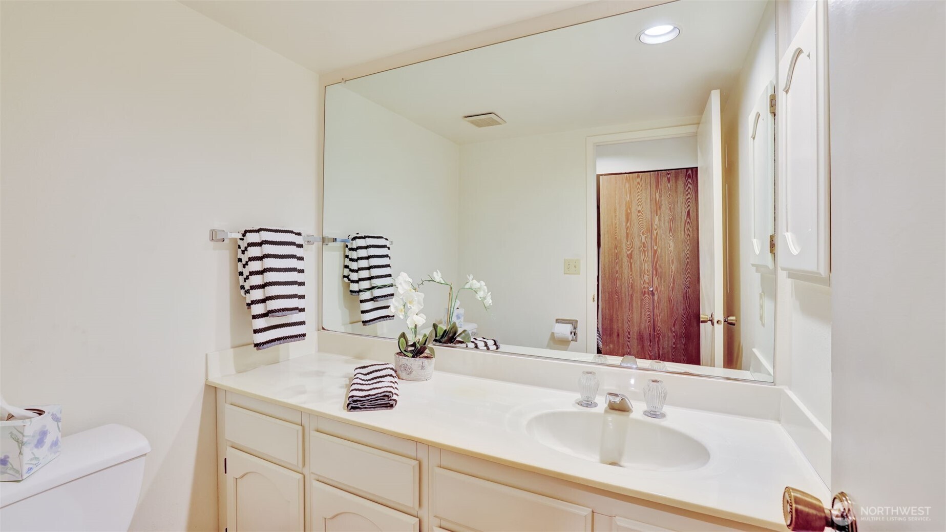 A well-appointed 1/2 bath, ideal for everyday use or guests