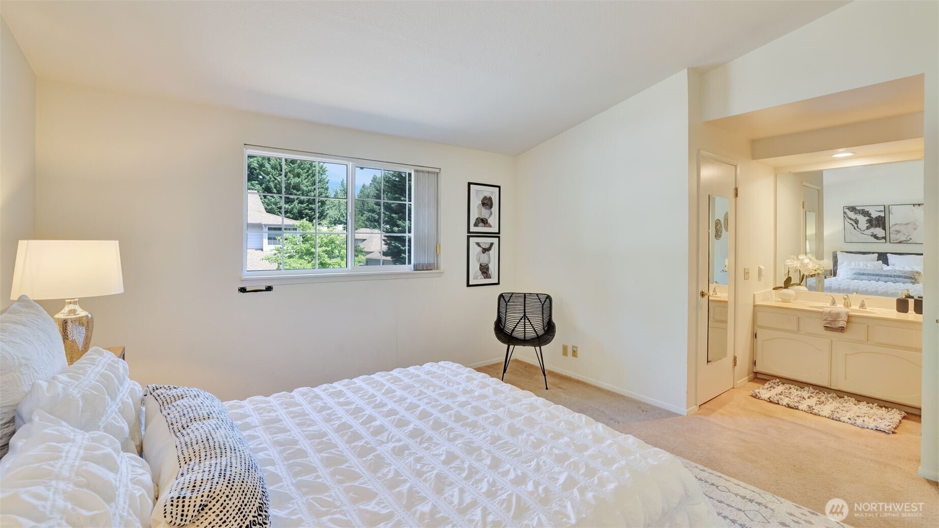 The primary bedroom boasts a large open layout with a walk-in closet adjacent to the ensuite bathroom, perfect for storing all your bathroom necessities