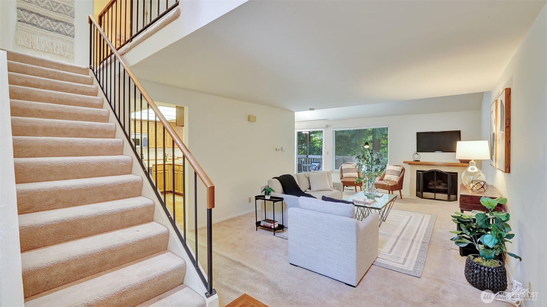 Admire the spacious staircase adorned with an elegant railing, adding a touch of sophistication to the home