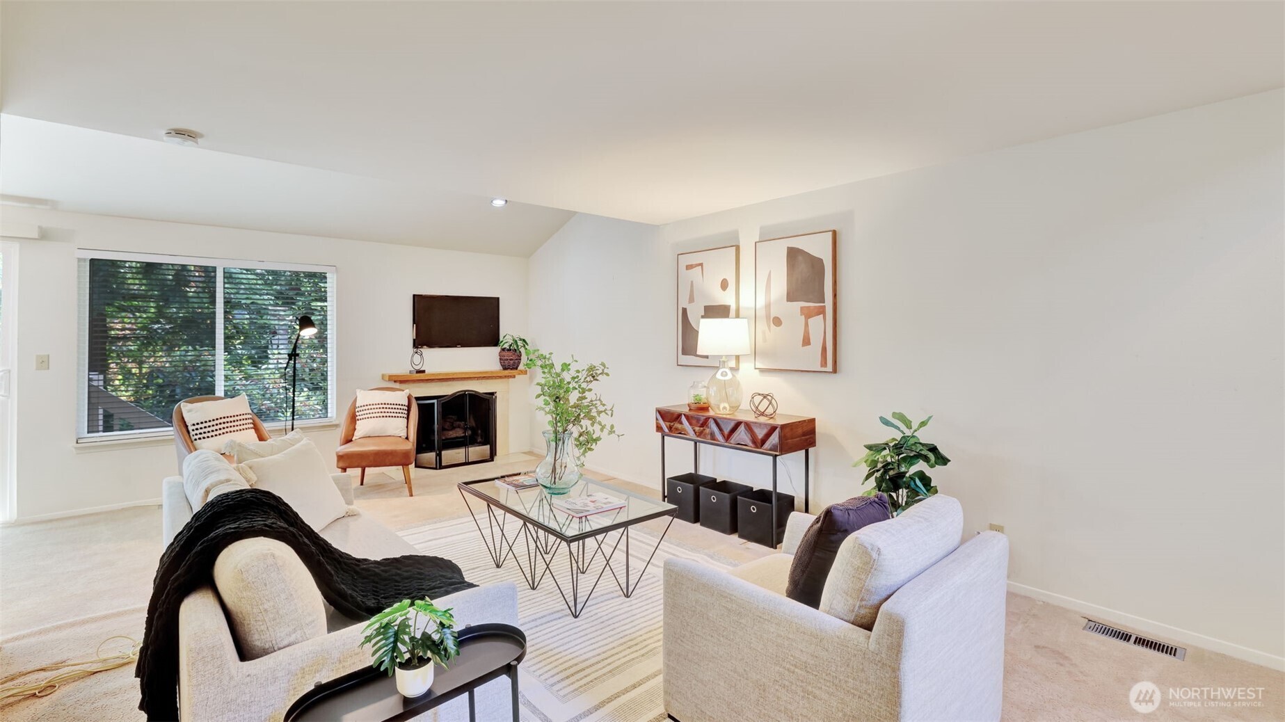 Gather around this inviting fireplace accented with elegant tile, surrounded by open living space ready for your custom furniture choices