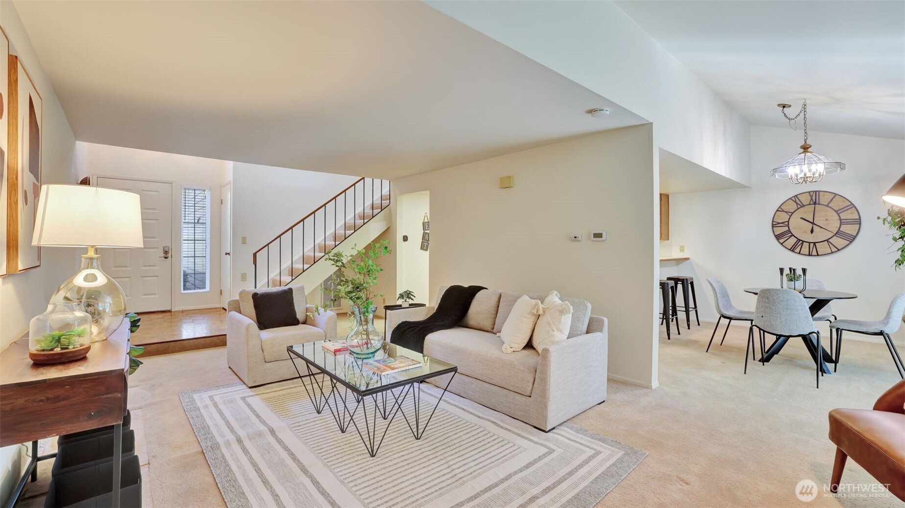 An uninterrupted design links the kitchen, living space, dining area, and stairs, fostering a harmonious and airy atmosphere throughout the home!