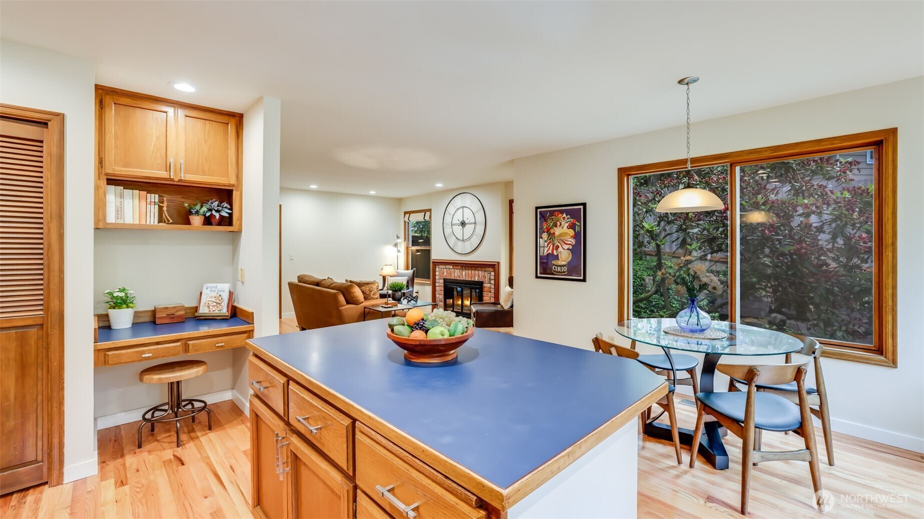 The kitchen offers a phone desk, pantry and a broom/storage closet.