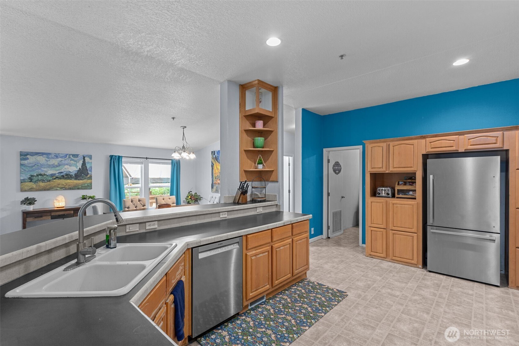 The heart of the home! This expansive kitchen features ample cabinetry, a stainless steel appliance suite, and loads of counter space for meal prep or hosting. Open to the living and dining areas, it makes staying connected a breeze.