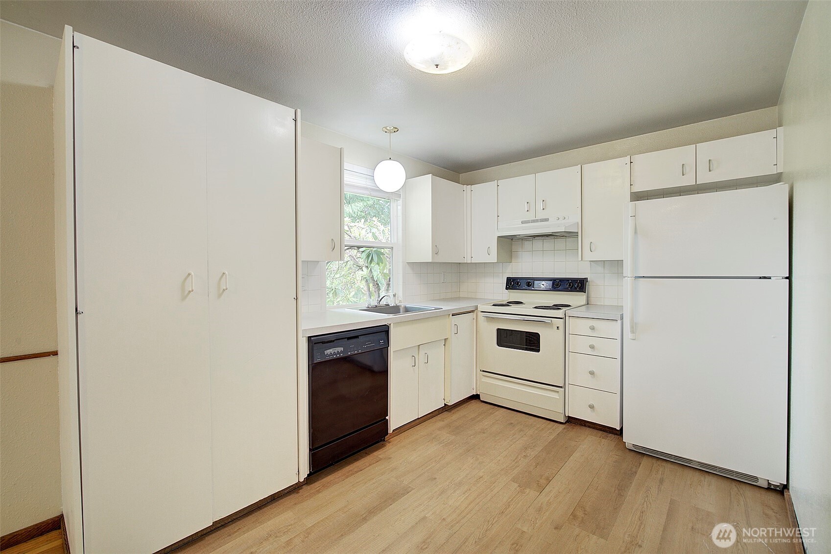 Kitchen with large pantry cabinet