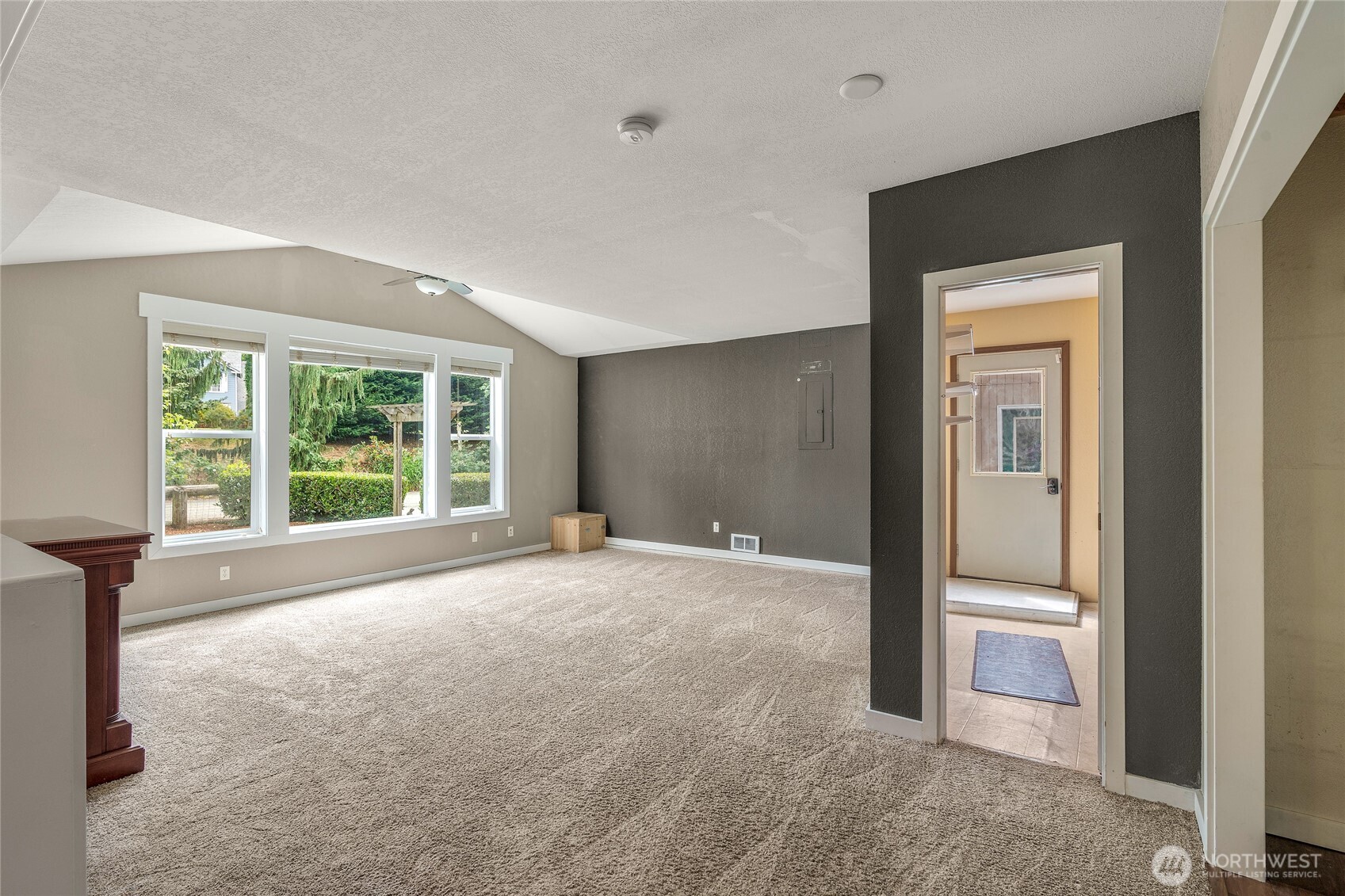 Sunken Living room with utility room access